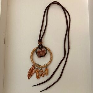 Vintage tan pendant with open cord necklace